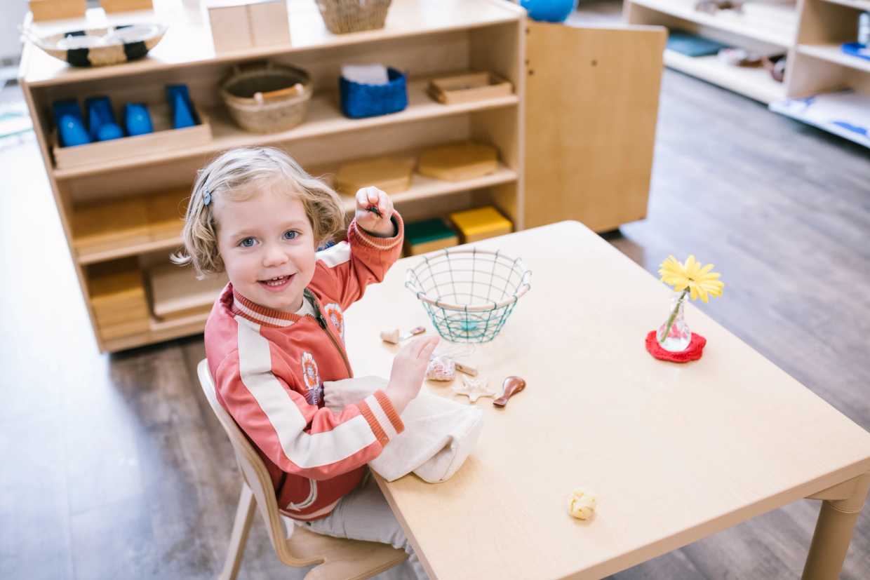 Child in a prepared Montessori classroom