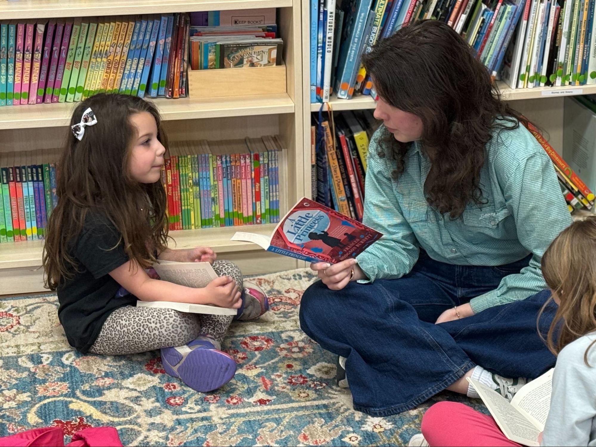 Students reading A Little Princess together during a literature circle