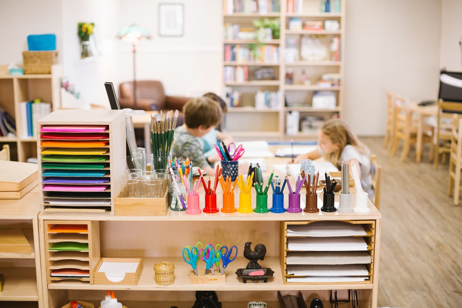 Child working independently in a Montessori classroom environment